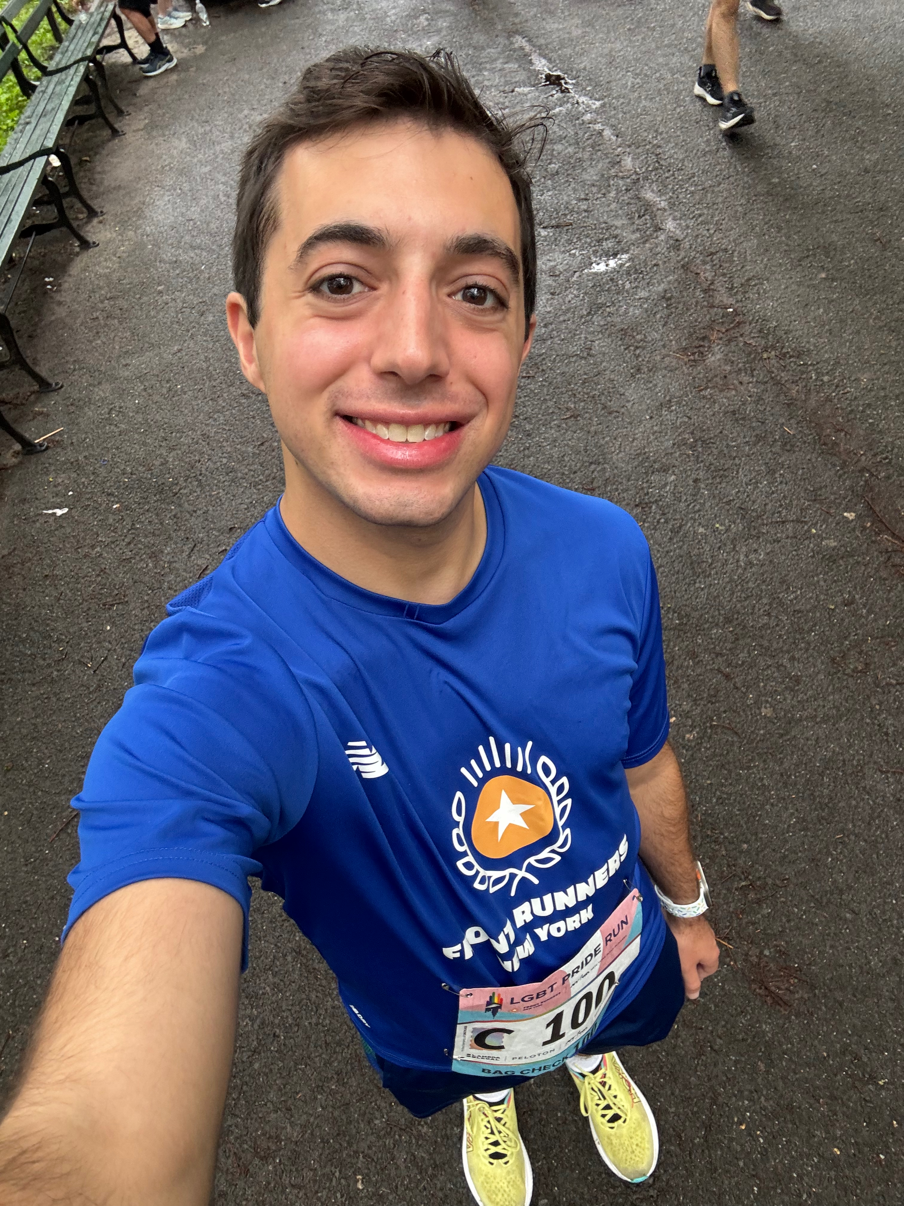 Jack taking a pre-race selfie in Central Park wearing his Front Runners New York kit and race bib
