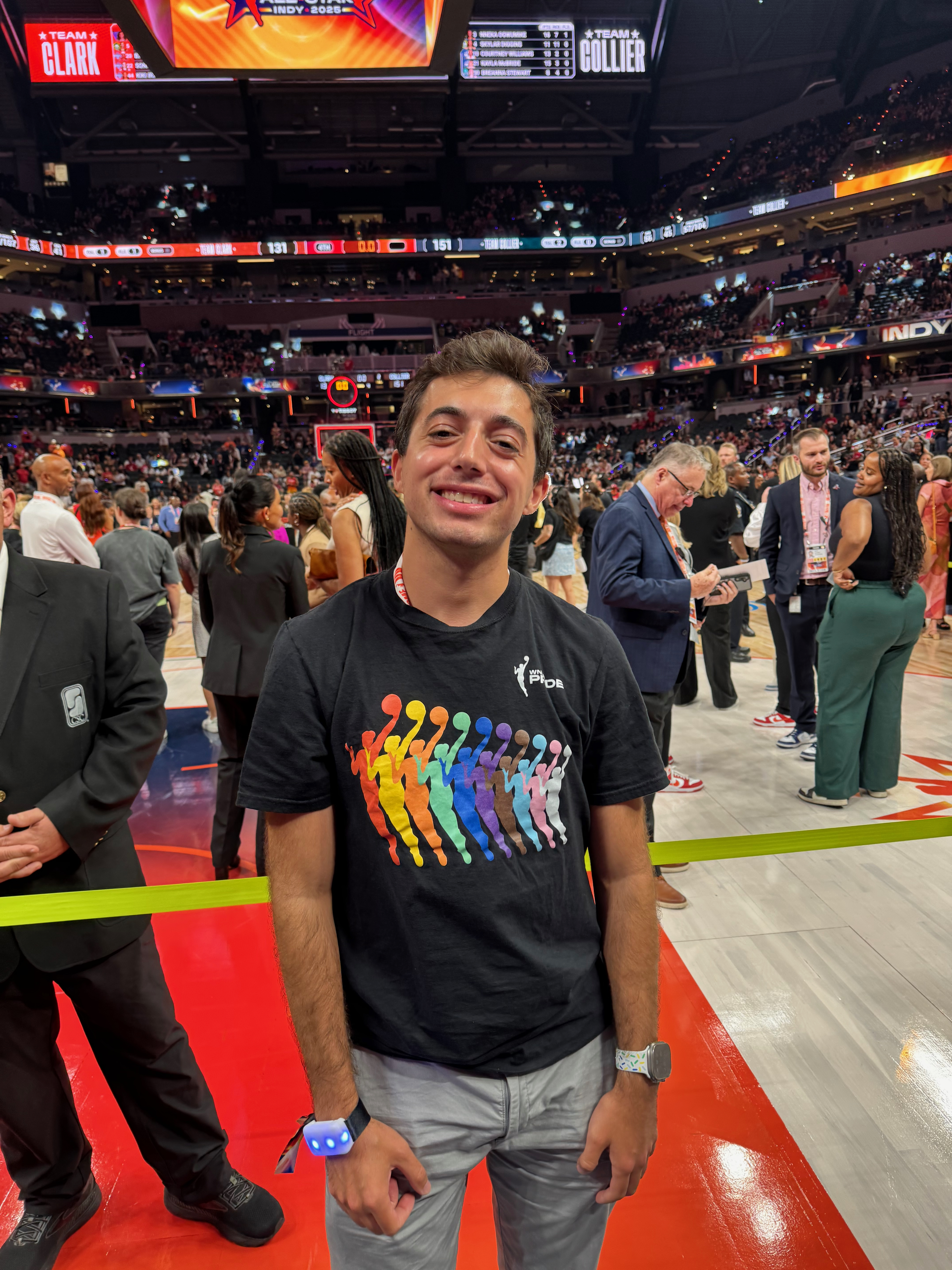 Jack on the court at the WNBA All-Star Game in Indianapolis, wearing a WNBA Pride shirt